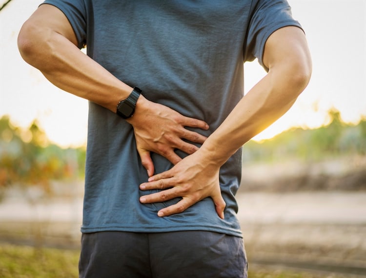 Back pain, close up of young man