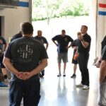 Beacon orthopedics team educating the Amberley Village police department on rehabilitative strategies you can do at home to relieve pain.