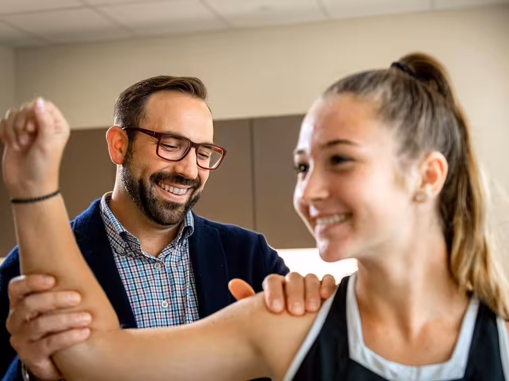 Shoulder Beacon Orthopedic doctor seeing a patient about ongoing shoulder pain